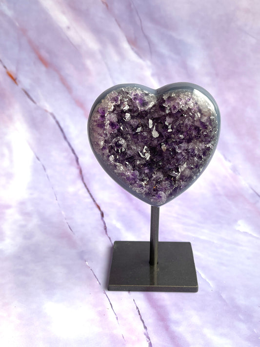 Agate/Amethyst heart on a fixed stand.