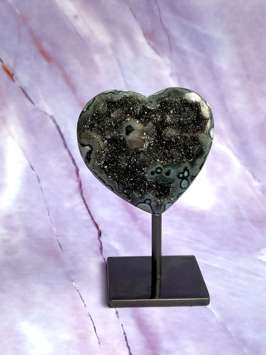 Jasper druzy heart on a fixed stand.