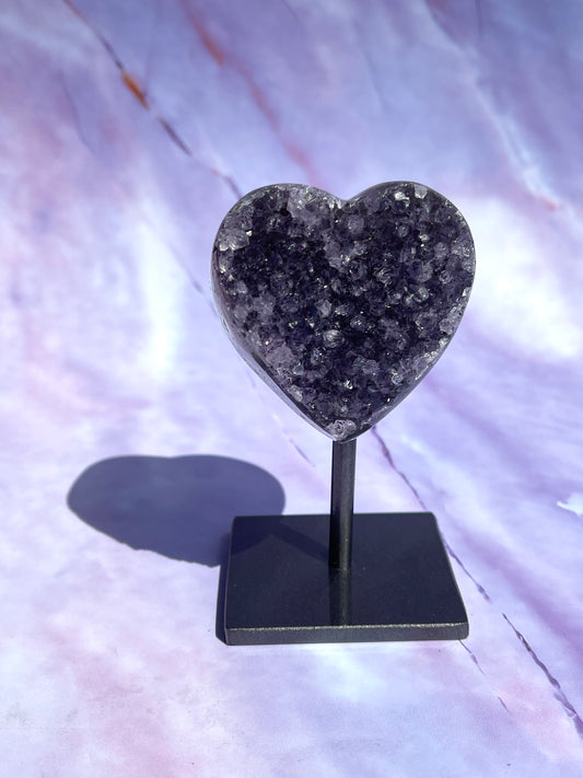 Amethyst heart on a fixed stand.